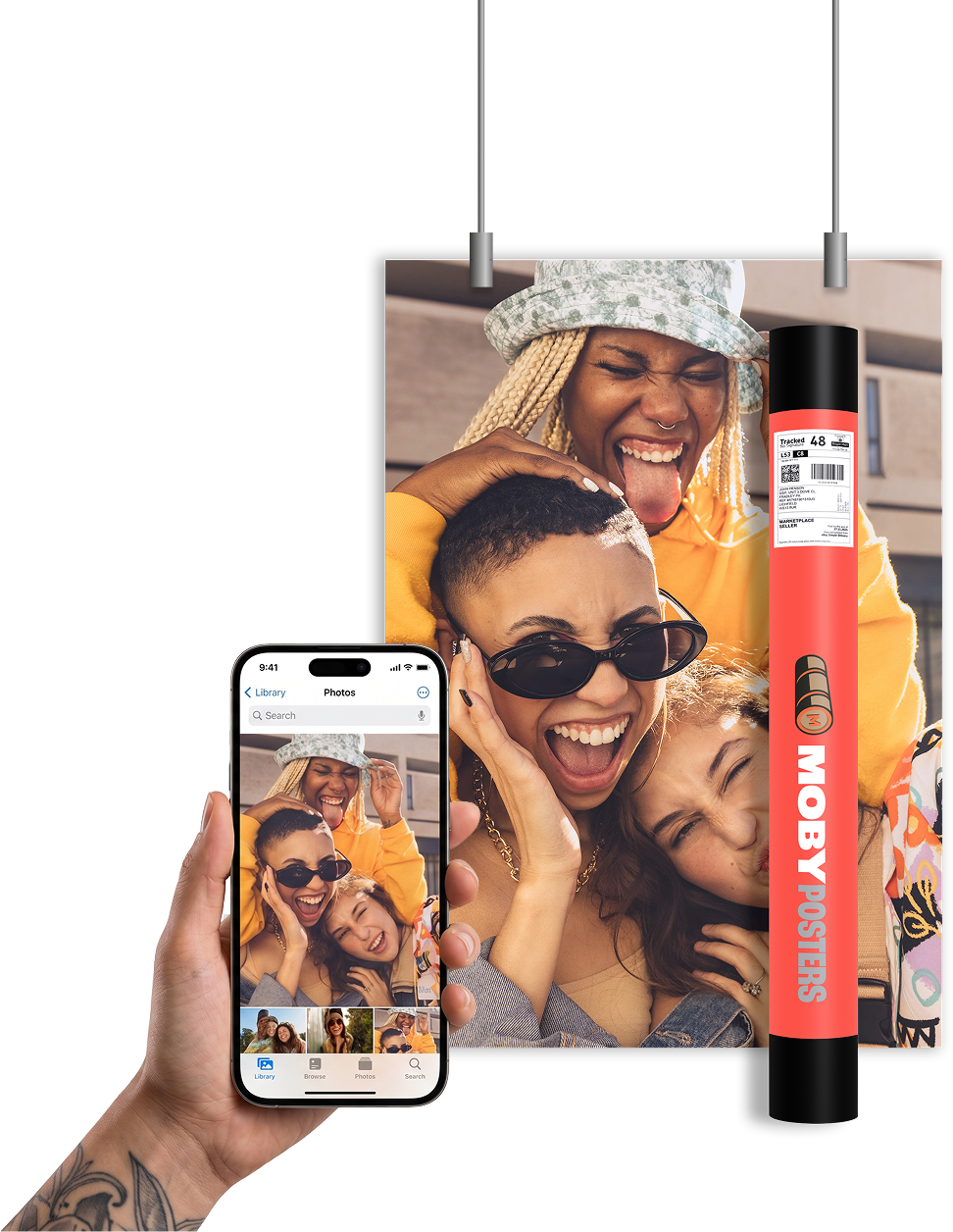 A printed poster of friends together hanging on a wall, the phone photo it was printed from, and a Moby Posters print tube