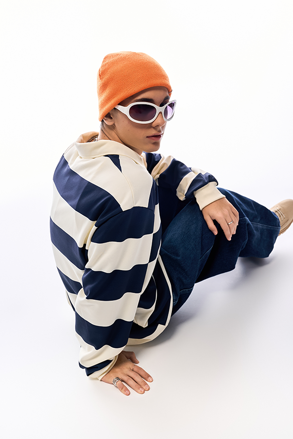 A sharp, high-resolution photo of a person in a striped jumper - suitable for printing